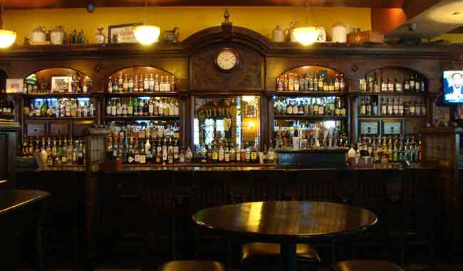 Photo of James Joyce authentic handsome Irish dark wood bar imported from Ireland, an inviting setting to have a drink, 616 S. President Street, Harbor East, Baltimore MD